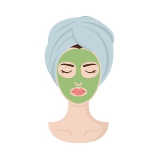 woman with hair wrap and face mask on at the spa